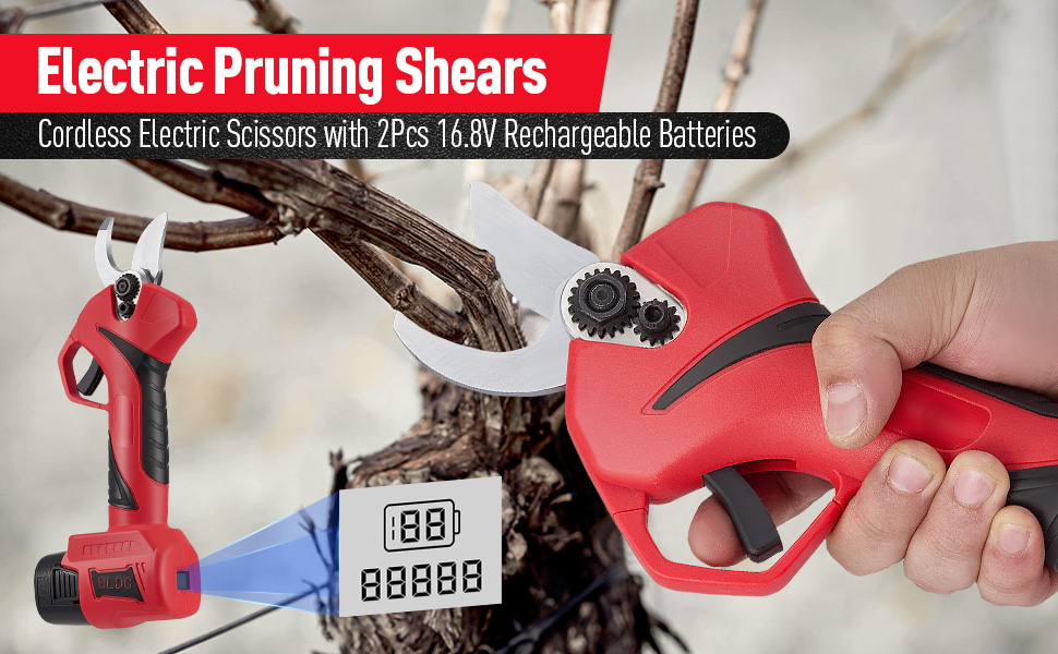Red electric pruning shears with digital display, shown in hand demonstrating cutting position.