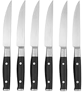 Black knife block set with multiple knife slots arranged in angled design, includes visible kitchen knife with black handle.