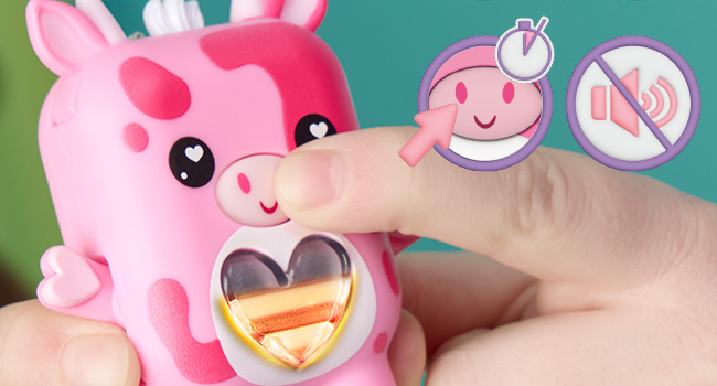 Cute red fox-themed digital device or toy with heart emblem on chest, featuring cartoon-style design with black accents against green background.