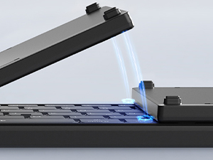 Close-up of black plastic mounting brackets or clips shown against dark background.