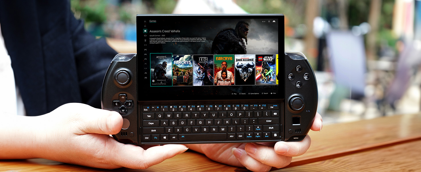 GPD WIN 4 in Black being help in one hand showcasing it's portability and ability to play games