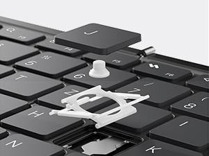 Close-up shots of a black electronic device or component being folded or manipulated, showing flexible material properties and different angles.