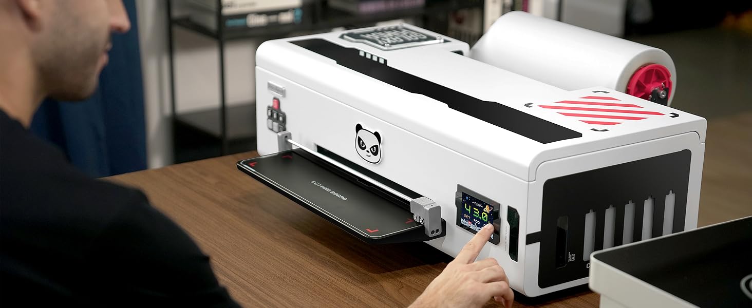 Electronic device with display screen shown in use on desk surface, featuring white casing and control interface.