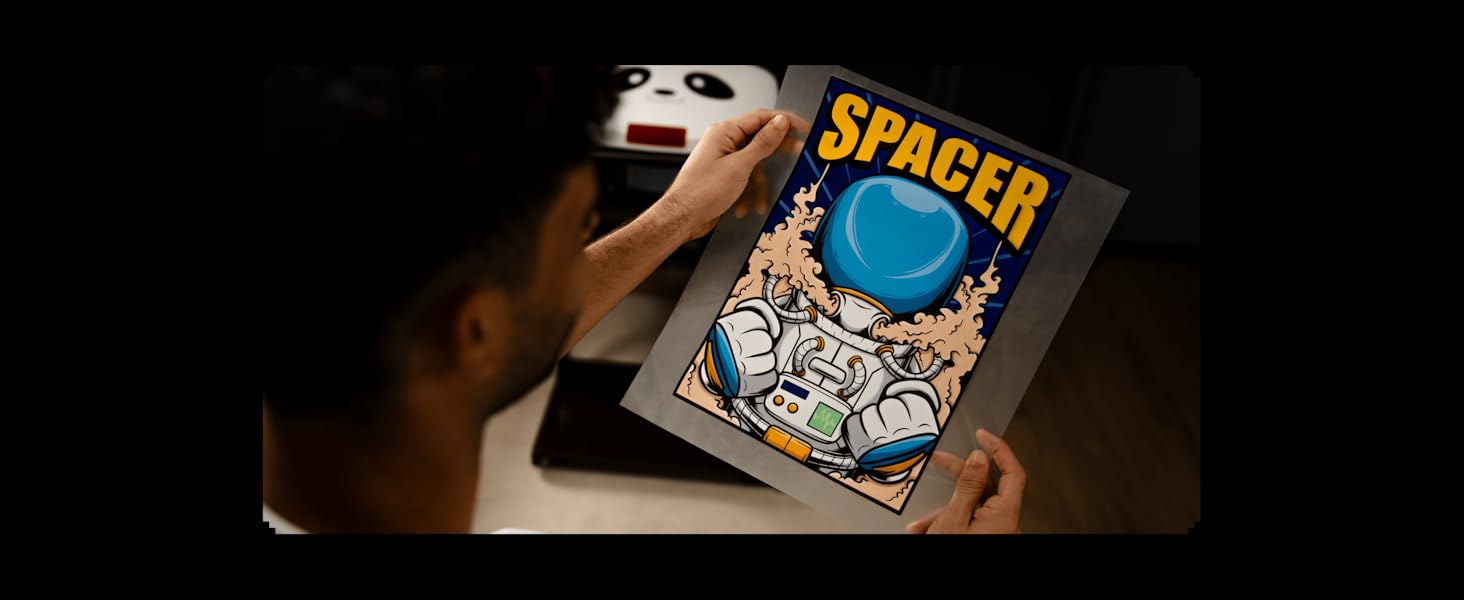 Text reads 'SPACER'. Dark-tinted image showing hands holding a gaming device or screen displaying a game interface.