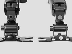 Close-up views of black camera mounting hardware components attached to wooden surfaces, showing various angles of professional mounting brackets and fixtures.