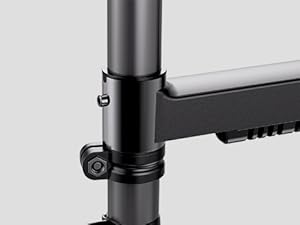 Multiple views of a modern black desk or table mount system shown from different angles, displaying adjustable components and mounting mechanisms.