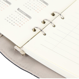 Close-up sequence of white paper or document pages being turned, showing texture and movement of pages in natural lighting.