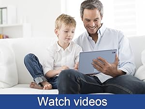 a person is sitting at a table with a laptop in front of them.